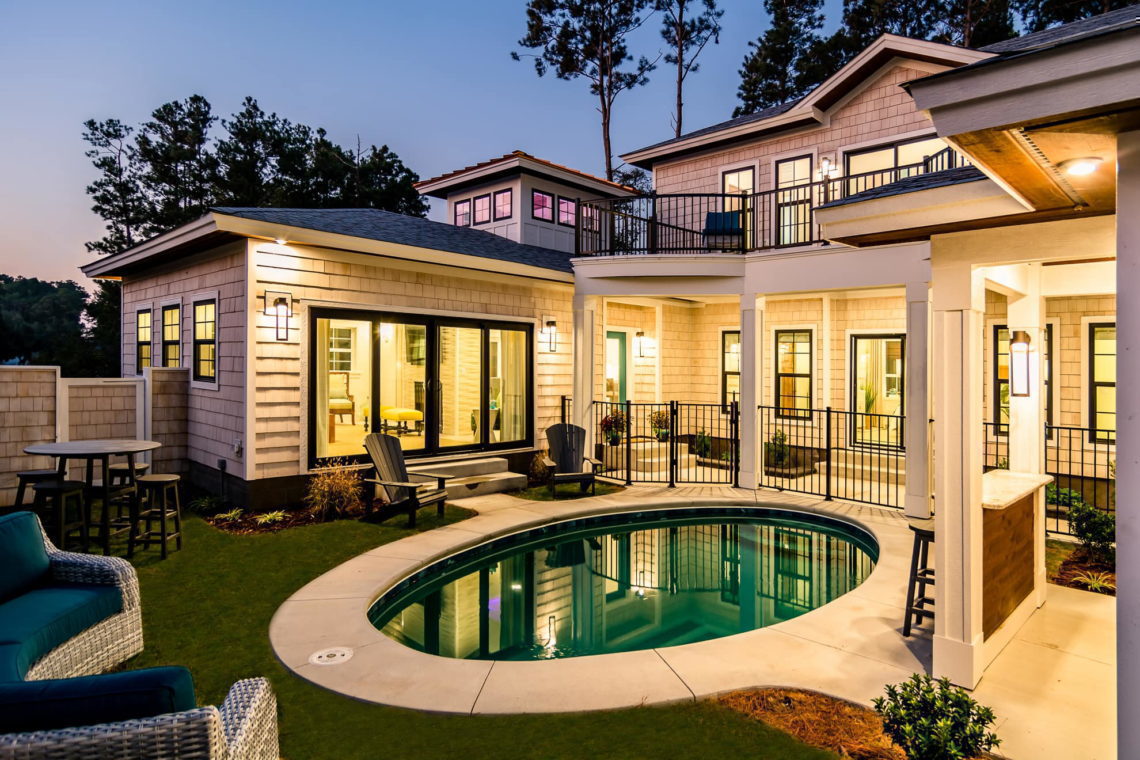 SAGA Realty & Construction, Inc. stunning new home with pool
